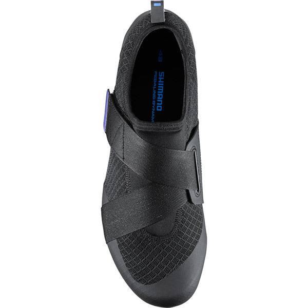 Shimano IC100 indoor cycling road shoes with breathable mesh and SPD compatibility, shown with sleek design and adjustable straps.