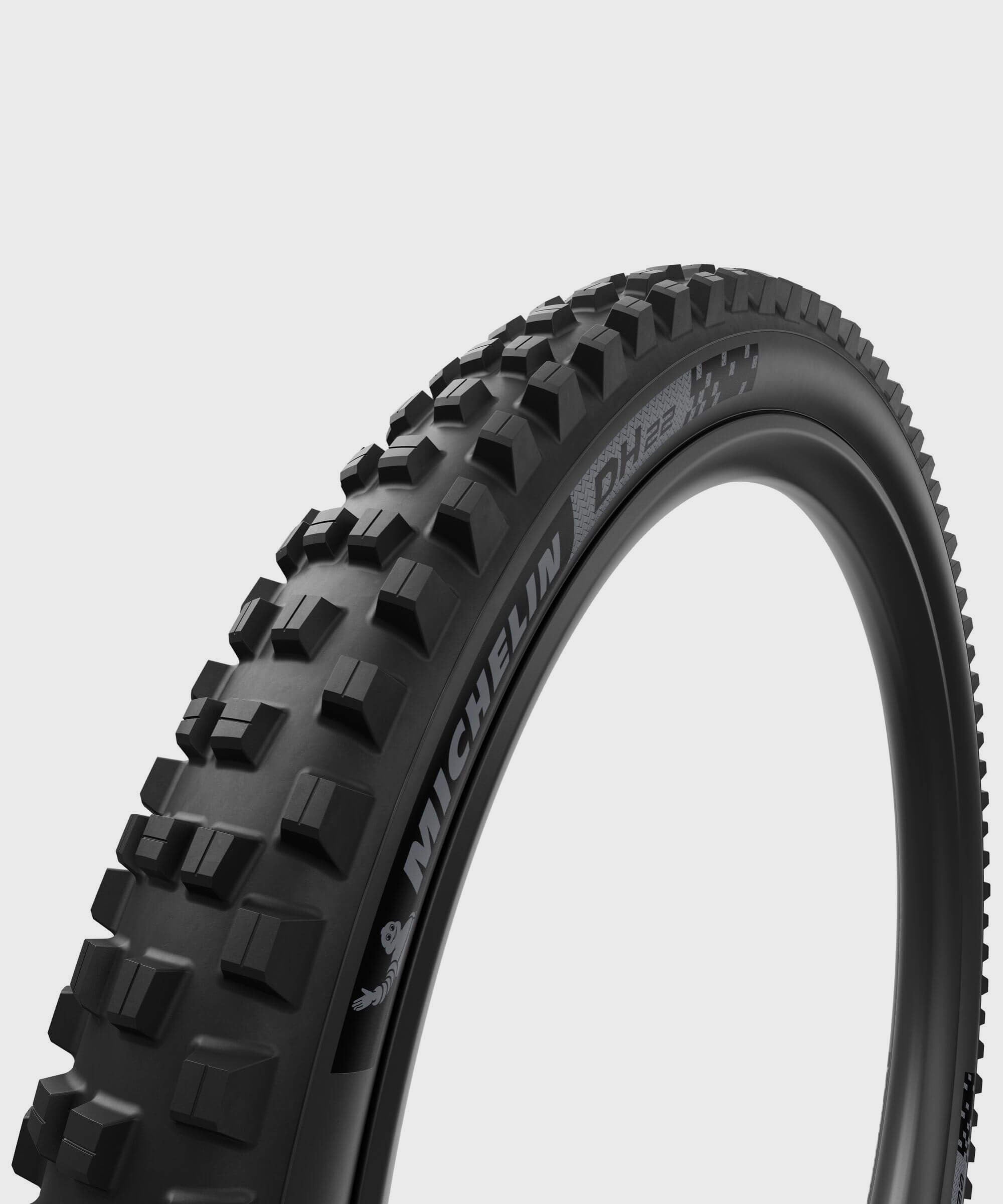 Michelin DH22 Racing Line downhill tubeless-ready mountain bike tyre on 27.5" or 29" wheel, with tread pattern suitable for downhill riding.