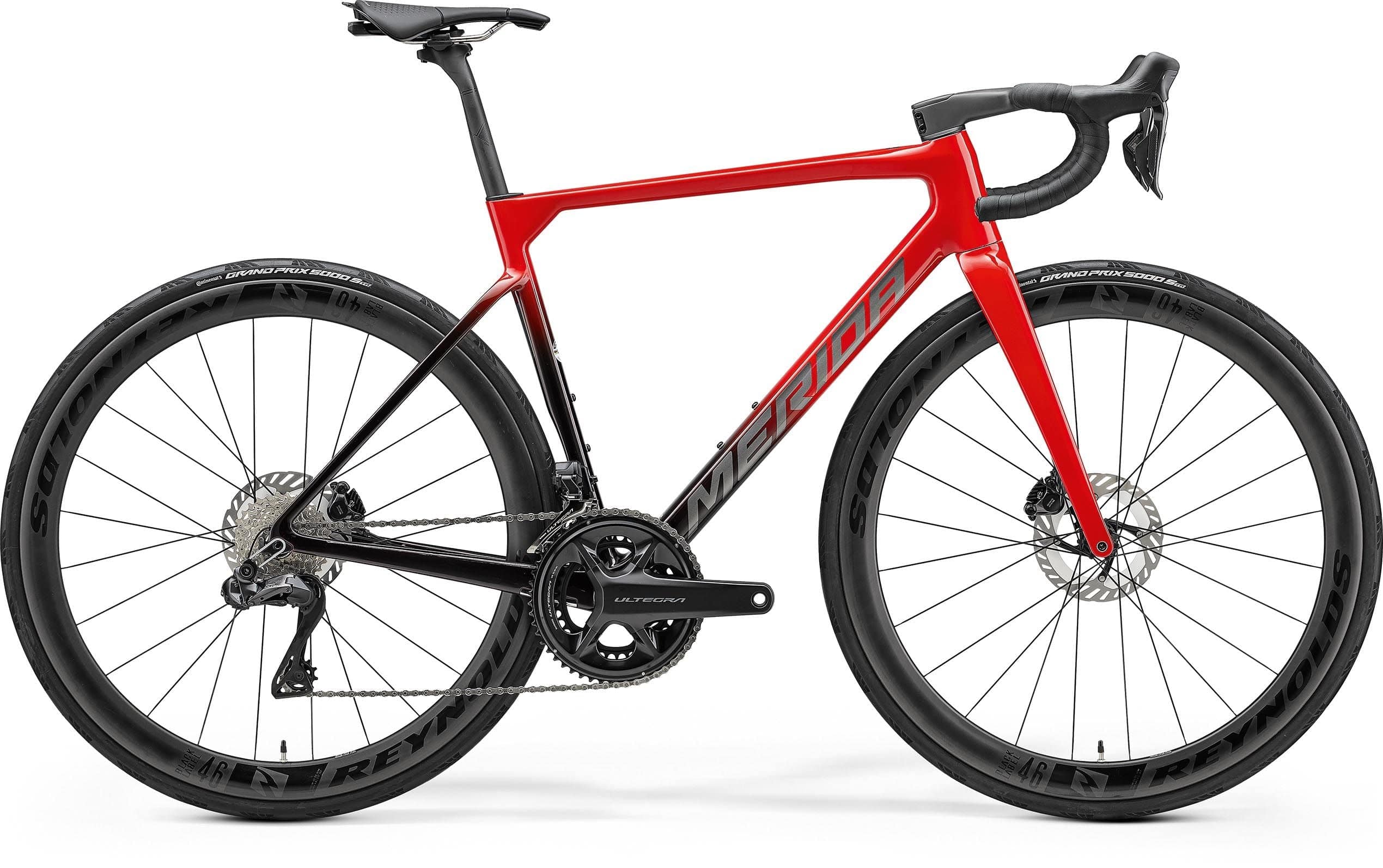 Merida Scultura 9000 road bike with Shimano Ultegra Di2 R8100 groupset and disc brakes, shown with sleek frame and road tires.
