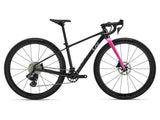 Liv Seek 1 MY26 Youth Gravel Bike with hydraulic disc brakes and adjustable seatpost, shown on a trail with rugged terrain.