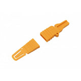 Jagwire yellow disc brake pad spacer and bleed block for hydraulic bike brakes, used in workshop maintenance and bleeding.