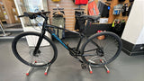 Giant Escape Disc 2 hybrid bike with Shimano Altus gears and disc brakes, 2025 model, shown with black frame and comfortable saddle.