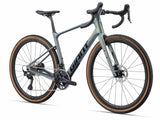 Giant Revolt Advanced 0 gravel bike with adjustable wheelbase and integrated storage, shown with sleek frame and knobby tires.
