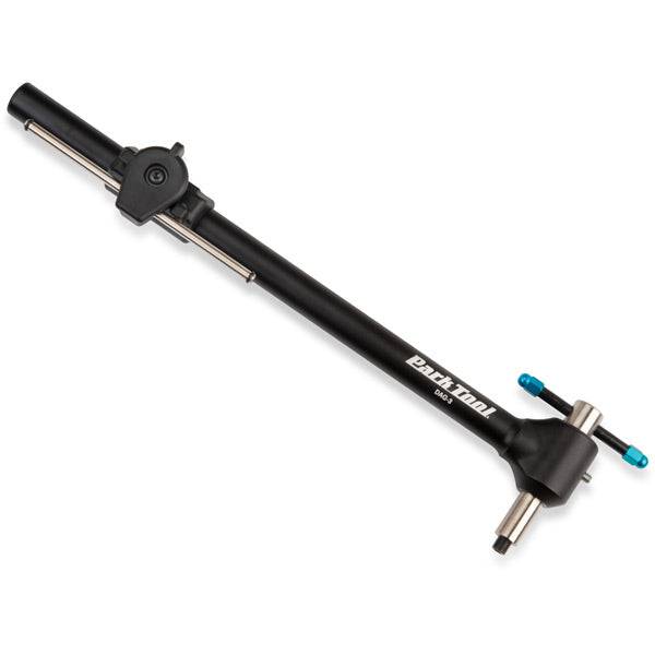 Park Tool DAG-3 derailleur hanger alignment gauge used in bike workshop for precise derailleur adjustments and repairs.