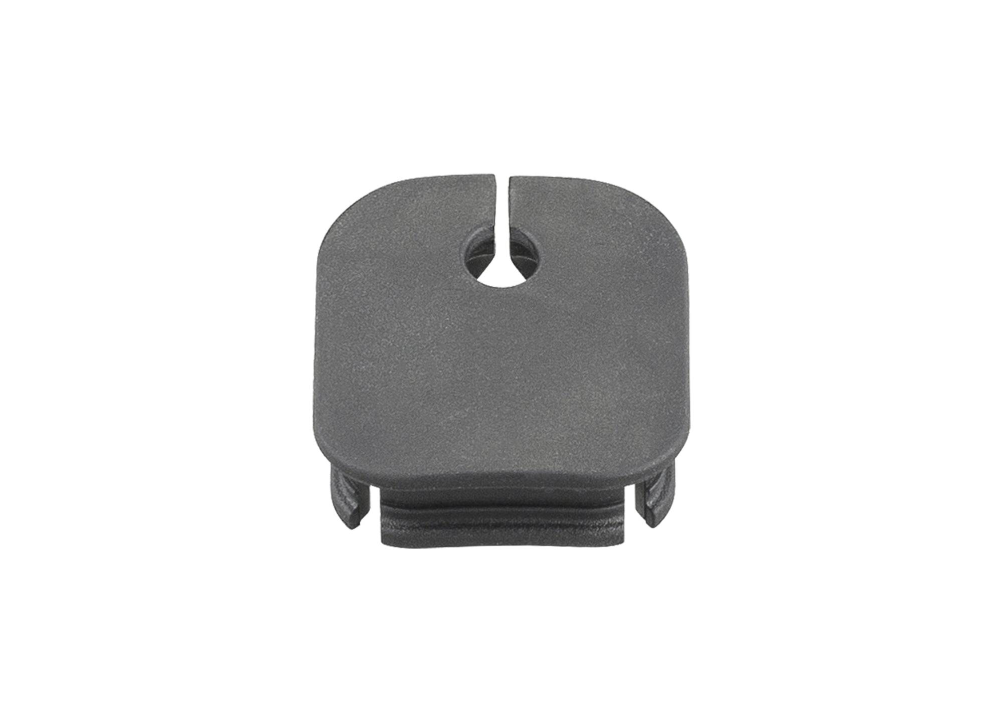 Black Trek Range Boost frame plug for e-bike battery system integration, designed for seamless component connection.