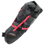 Zefal Z Adventure R17 bikepacking saddle bag attached to bike, waterproof, adjustable 8-17L capacity, outdoor cycling accessory.