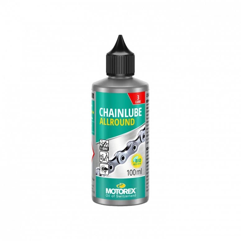 Motorex Chainlube Allround 100ml synthetic bike chain lubricant for dry conditions, shown in a workshop setting