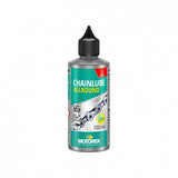 Motorex Chainlube Allround 100ml synthetic bike chain lubricant for dry conditions, shown in a workshop setting