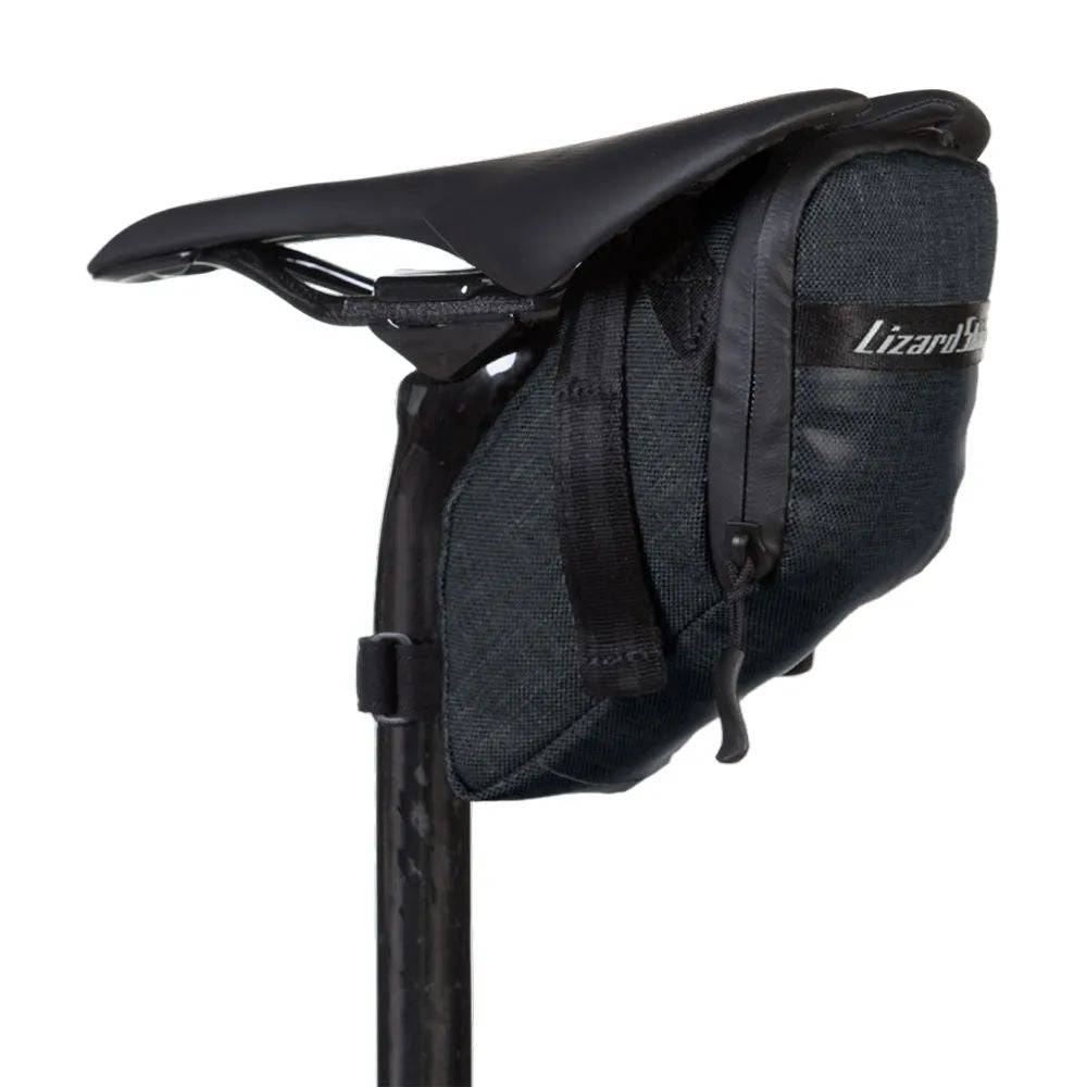 Lizard Skins Super Cache saddle bag in jet black, compact bike storage accessory attached to a bike saddle.