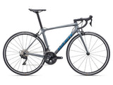 Giant TCR Advanced 2 road bike 2024 with Shimano 105 R7100 groupset and disc brakes, black and red frame, close-up of handlebars and drivetrain