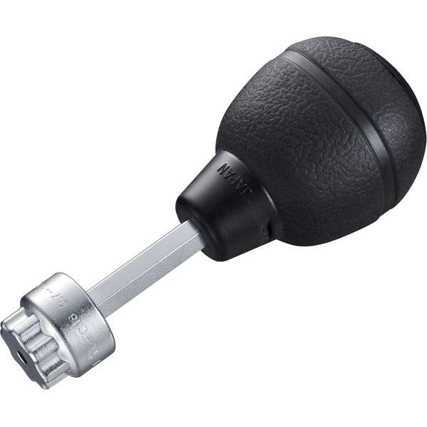 Shimano TL-FC18 HT II crank cap tool used in workshop for precise bike maintenance, with ergonomic handle and durable construction.