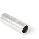 DT Swiss front axle spacer, 15mm by 57.2mm, genuine replacement part for bike wheel assembly, shown in workshop setting.