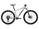 Giant Talon 0 2024 mountain bike with Shimano Deore M6100 disc brakes and XL frame, ready for trail riding.