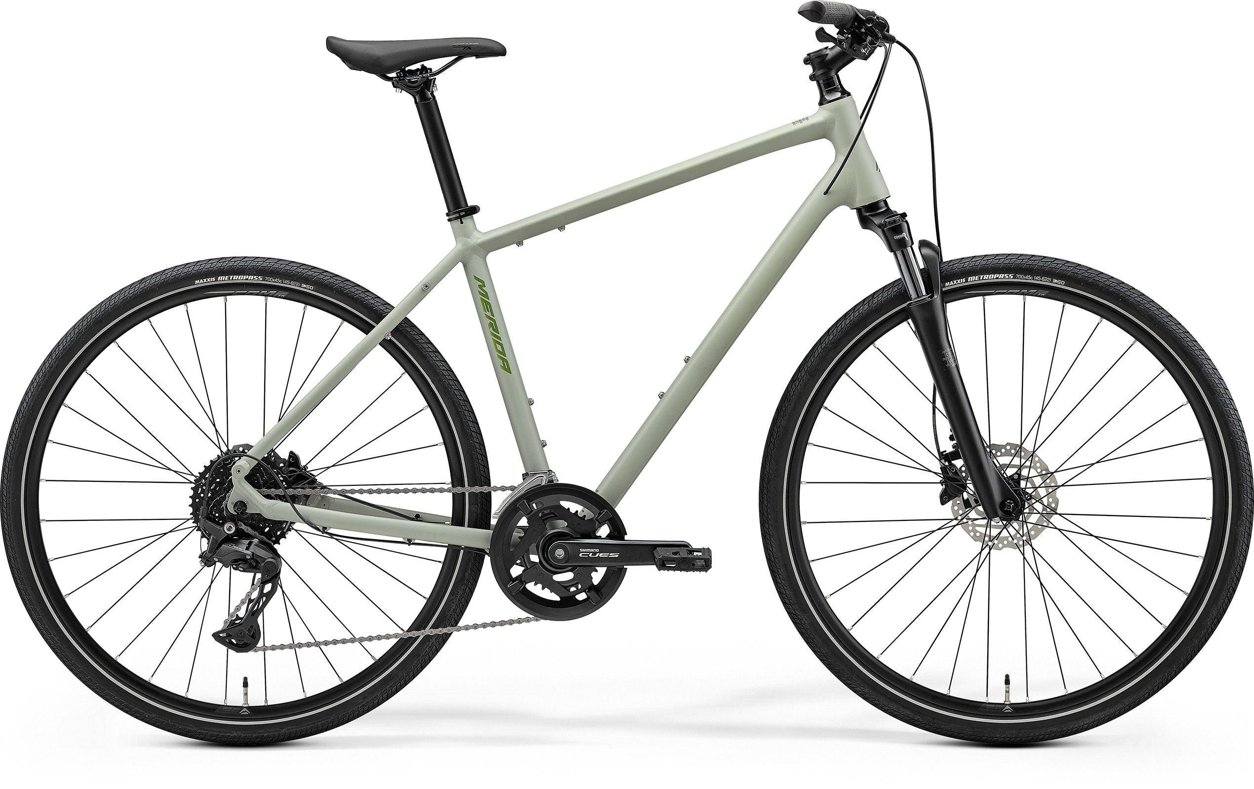 Merida Crossway 300 MY26 hybrid bike with Shimano 10-speed drivetrain and disc brakes, shown from side view on a paved path.