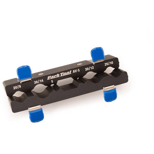 Park Tool AV-5 axle and pedal vice insert with aluminum jaws, ideal for workshop use, shown in a workshop setting.