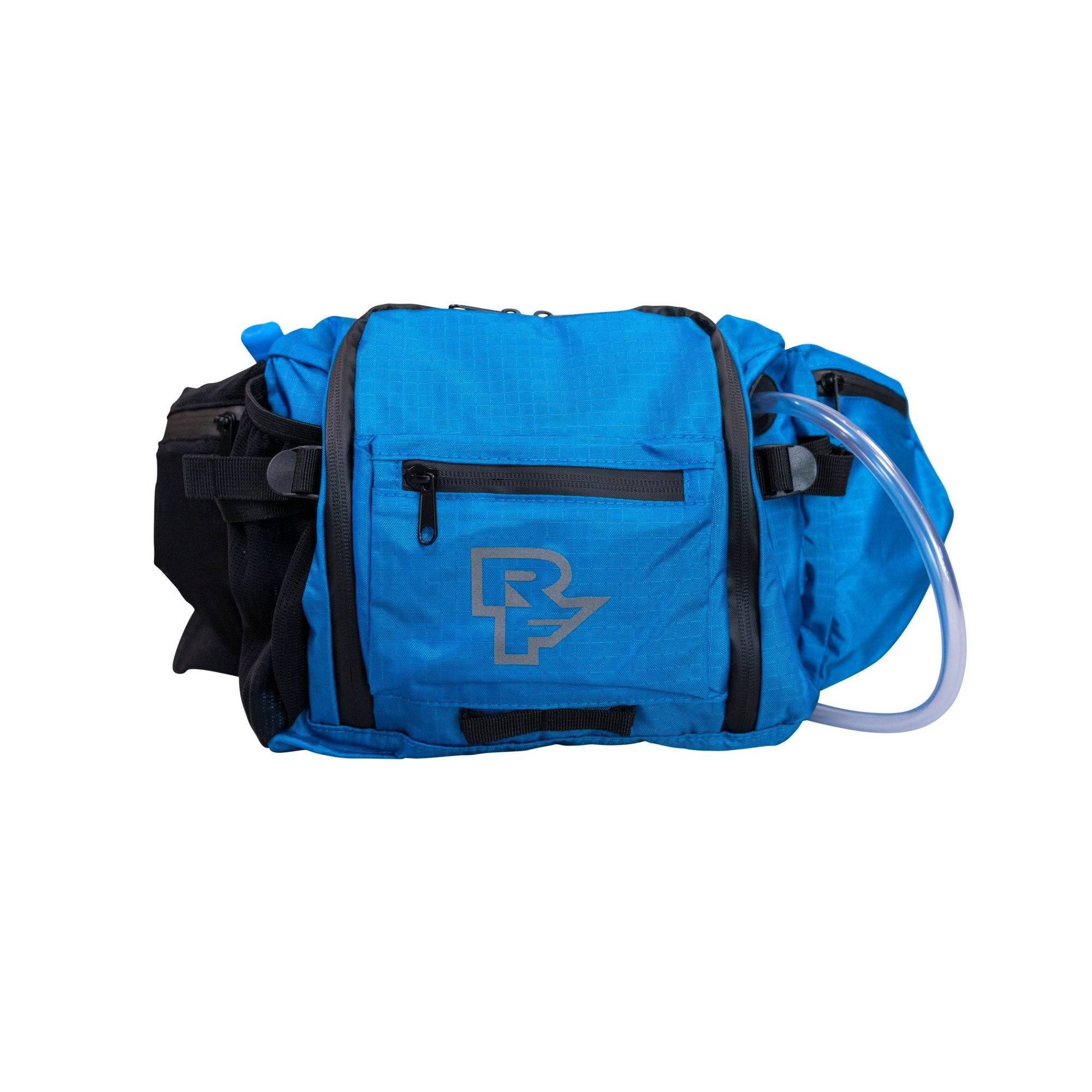 Race Face Stash 3L hydration hip bag with tool bench and 1.5L bladder, designed for biking accessories and storage.