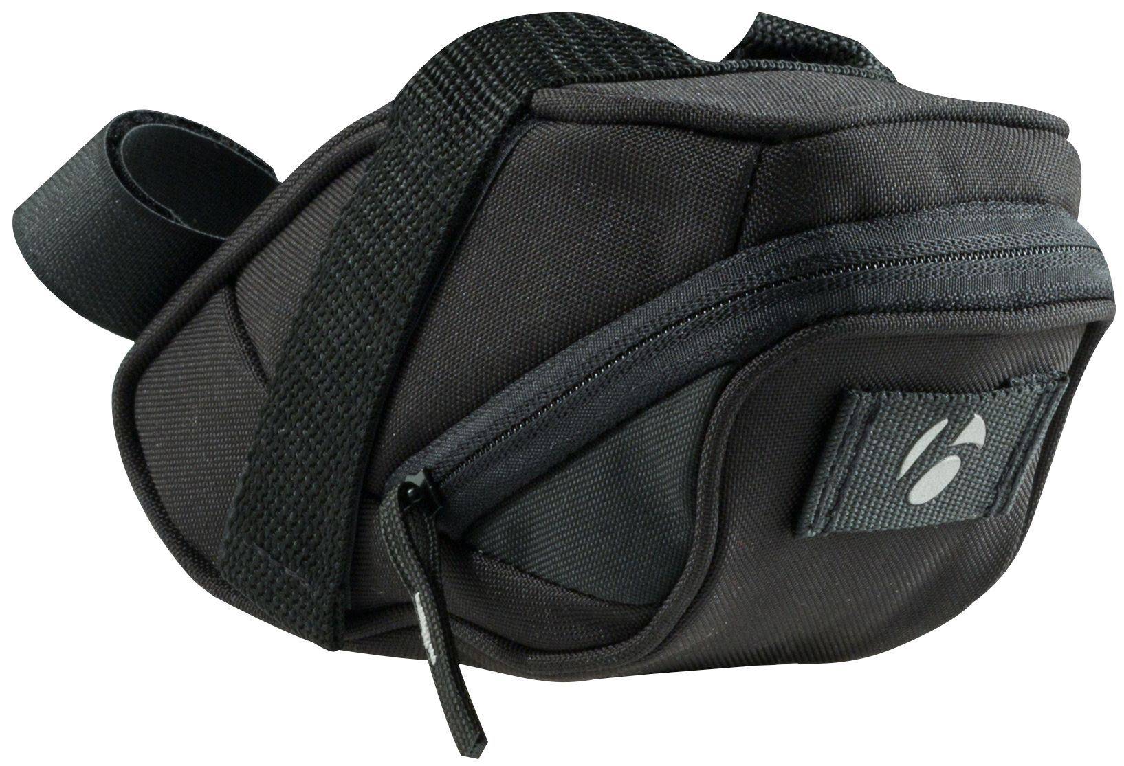 Bontrager Comp Seat Pack 1.23L black bike accessory with rear light tab mounted on bicycle saddle.