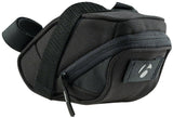 Bontrager Comp Seat Pack 1.23L black bike accessory with rear light tab mounted on bicycle saddle.