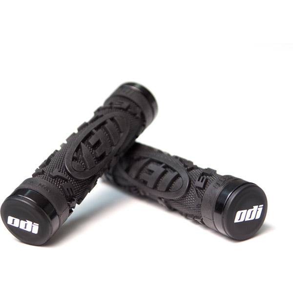 ODI Yeti Hard Core MTB lock-on grips in black with snap cap end plugs, designed for mountain biking handlebars.