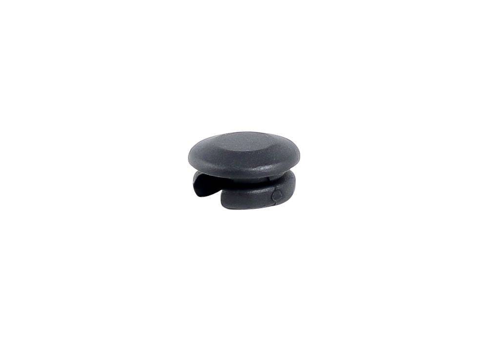 Black Trek seat tube wire routing frame plug for mechanical shifting cable management on bicycle frame.