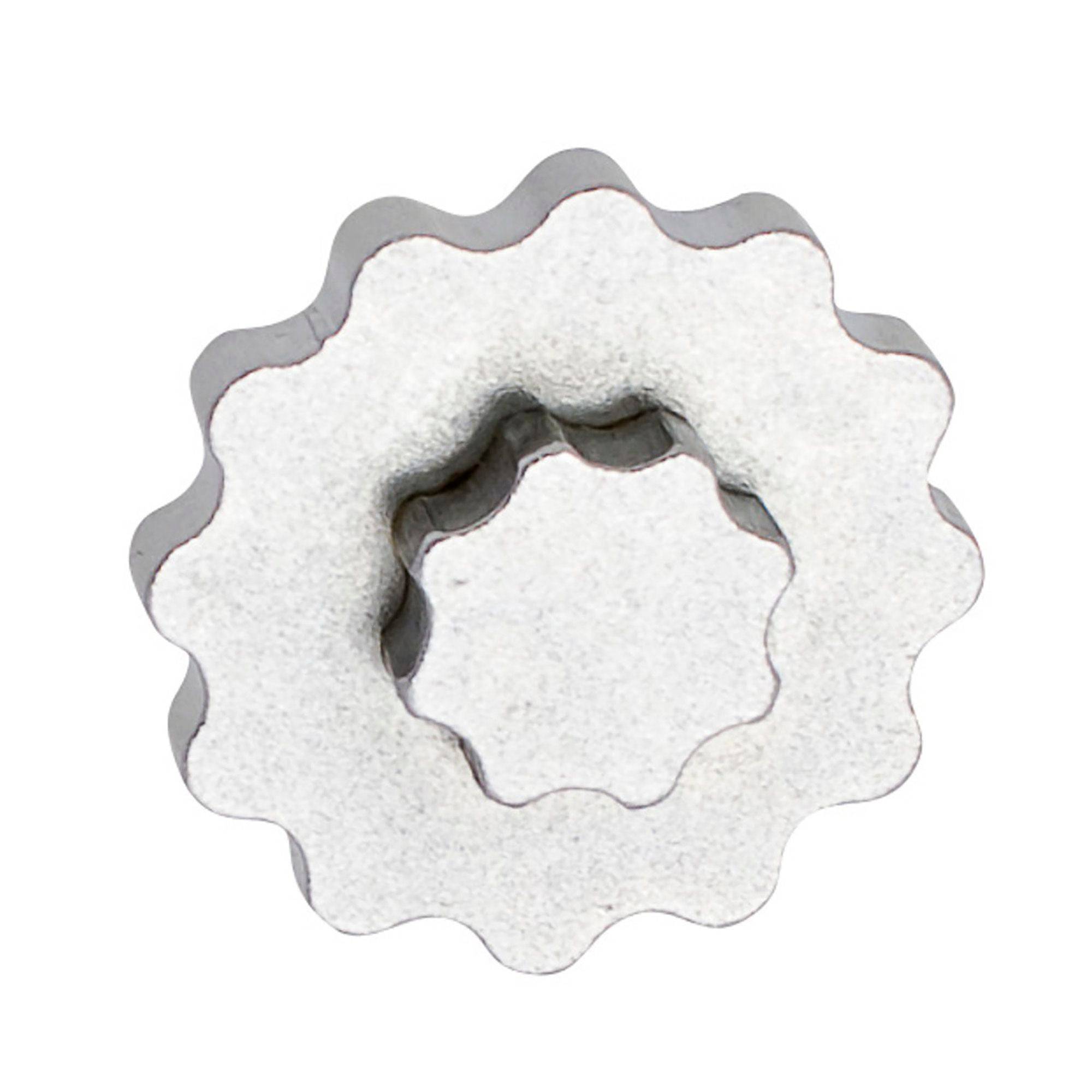 UNIOR metal crank cap tool for Shimano Hollowtech II with magnetic storage, used in bicycle workshop maintenance.