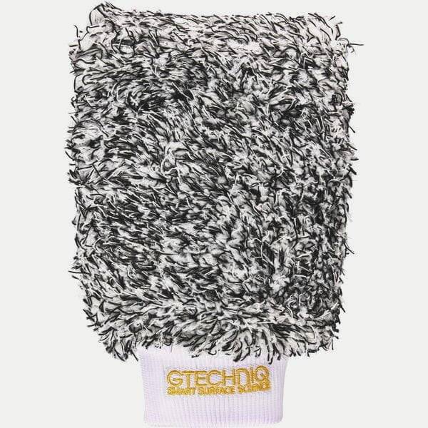 Gtechniq bike microfiber wash mitt for scratch-free cleaning, shown on a workshop surface, ideal for bike care and detailing.