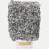 Gtechniq bike microfiber wash mitt for scratch-free cleaning, shown on a workshop surface, ideal for bike care and detailing.