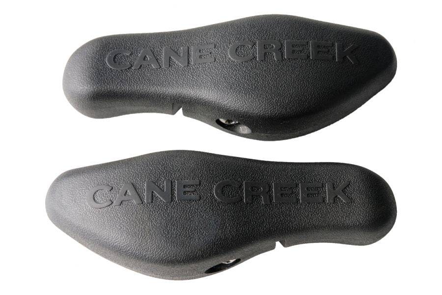 Cane Creek Ergo Control black bar end for ergonomic cycling handlebar comfort and control, mounted on bike handlebars.