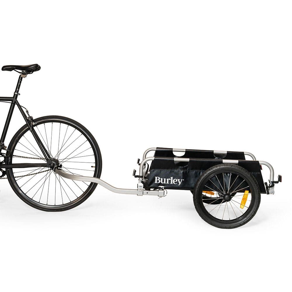 Burley Flatbed Cargo Bike Trailer, foldable two-wheel accessory with spacious platform for bulk hauling, shown with cargo.