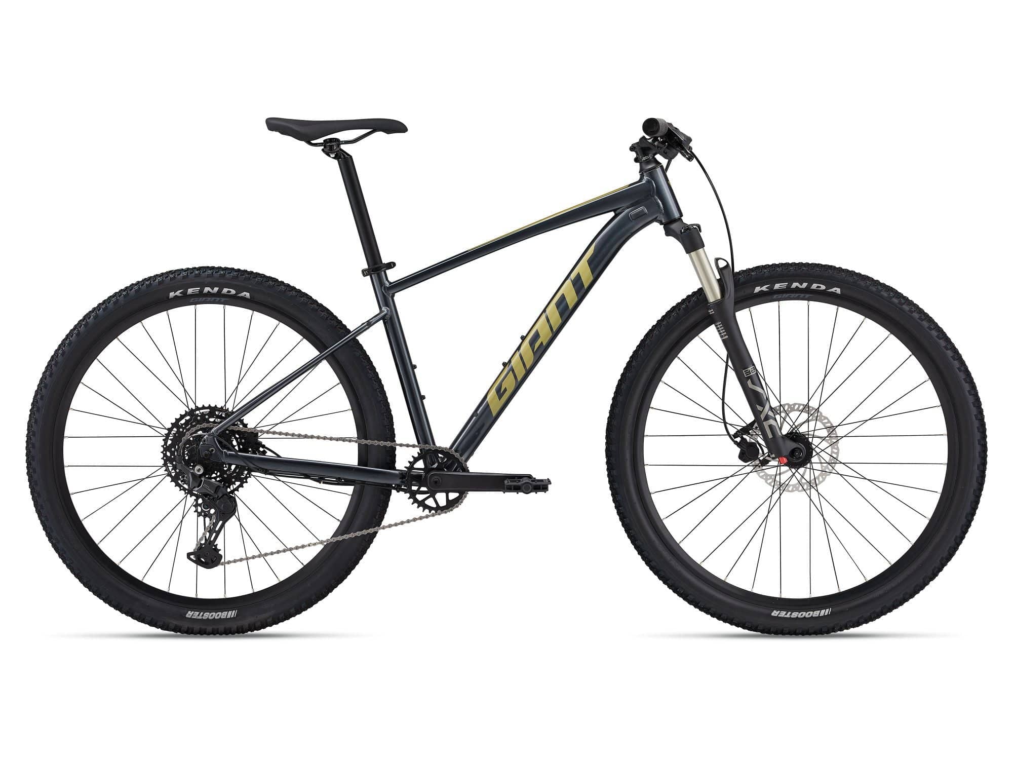Giant Talon 1 2024 mountain bike with medium frame and Shimano disc brakes, featuring rugged tires and a sleek black frame.