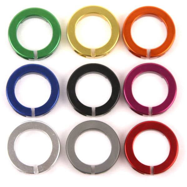 ODI Lock Jaw clamps with snap caps for lock-on grip system, MTB BMX ATV components, black and silver design, mounted on handlebars.