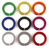 ODI Lock Jaw clamps with snap caps for lock-on grip system, MTB BMX ATV components, black and silver design, mounted on handlebars.