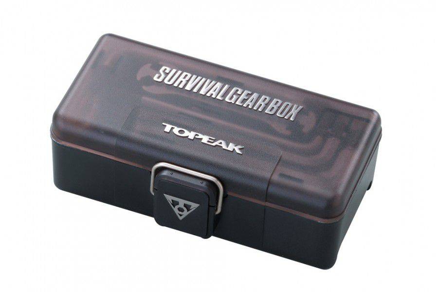 Topeak Survival Gear Box multi-tool kit in black and silver for bike repairs, shown open with various tools inside.