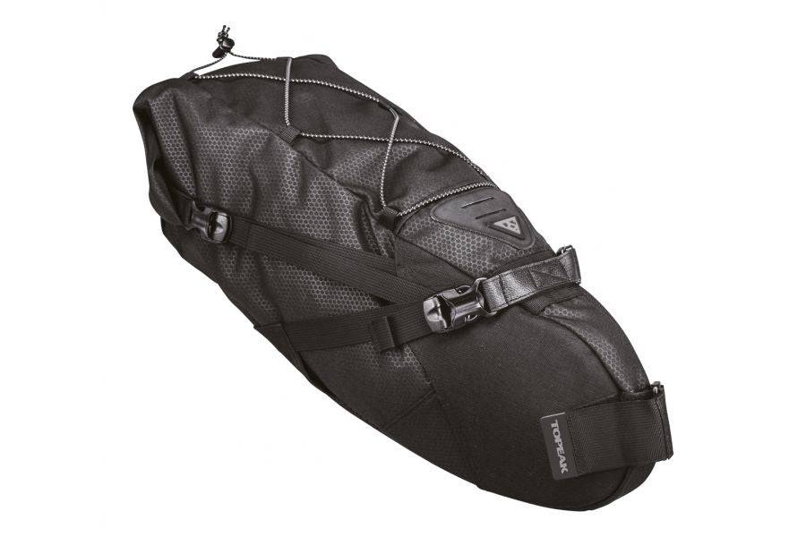 Topeak BackLoader bikepacking seat bag with water-resistant fabric and quick-release strap attached to a bicycle seat.