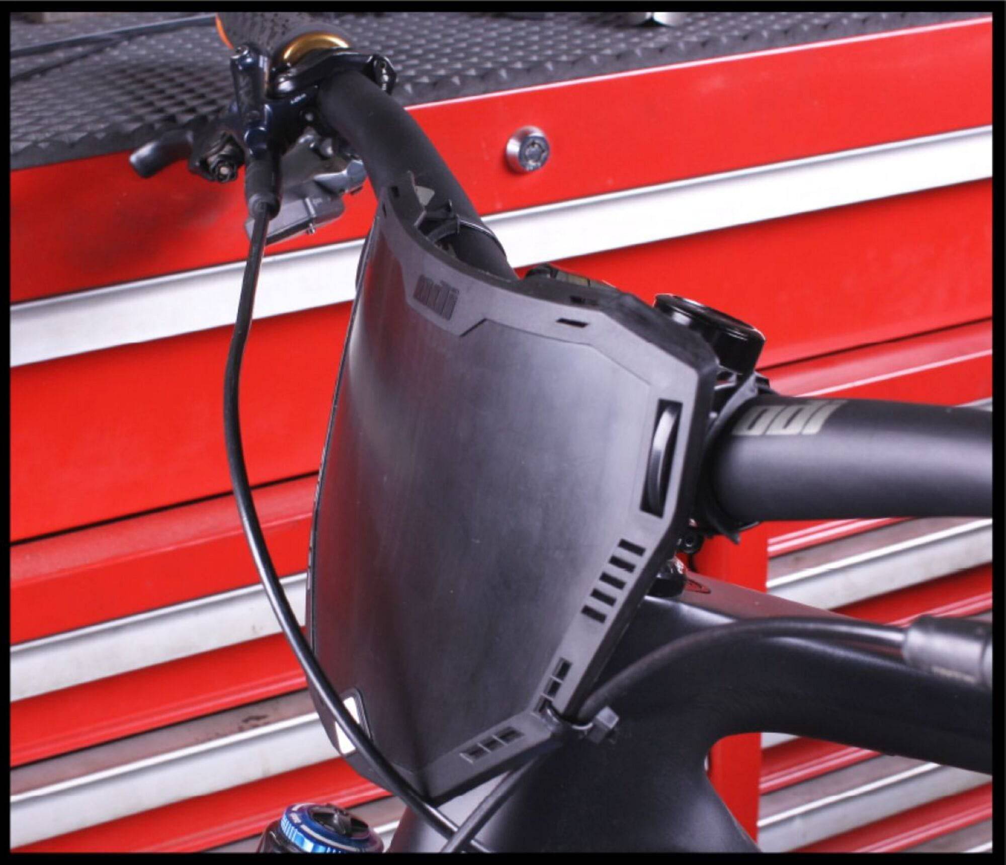 ODI Universal Enduro Bike Number Plate with adjustable offset mounting system, designed for durable bike component customization.