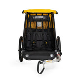 Burley Bee bike trailer for kids with 5-point harness and storage, designed for safe family cycling adventures.