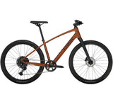 Trek Dual Sport 3 Gen 5 hybrid bike with Shimano CUES 1x10 drivetrain and hydraulic disc brakes, shown outdoors on a trail.
