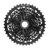 MicroSHIFT Advent H-Series 9-speed alloy cassette with 11-42T gear range for HG hubs, shown on a bike drivetrain.