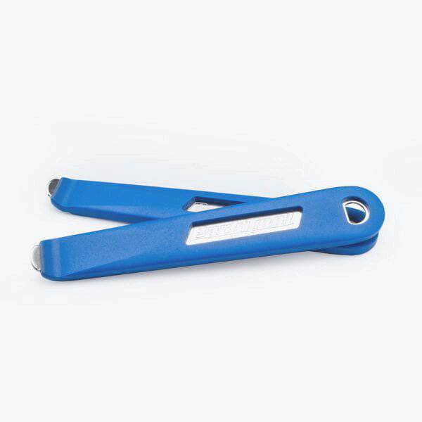 Park Tool TL-6.3 steel-core bicycle tyre lever set, two durable workshop tools for bike tire repair, shown in a workshop setting.