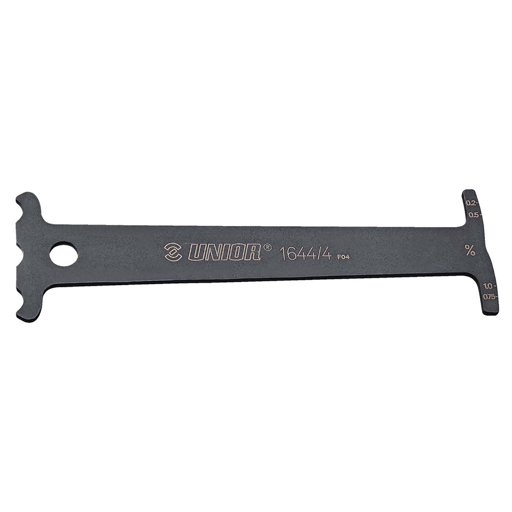 UNIOR workshop chain wear indicator tool for accurate bicycle chain measurement and maintenance, shown in use.