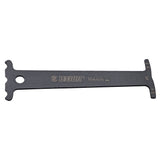 UNIOR workshop chain wear indicator tool for accurate bicycle chain measurement and maintenance, shown in use.