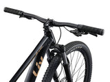 Liv Tempt 4 Trail Mountain Bike with ALUXX aluminum frame and 27.5-inch or 29-inch wheels, suitable for mountain biking.