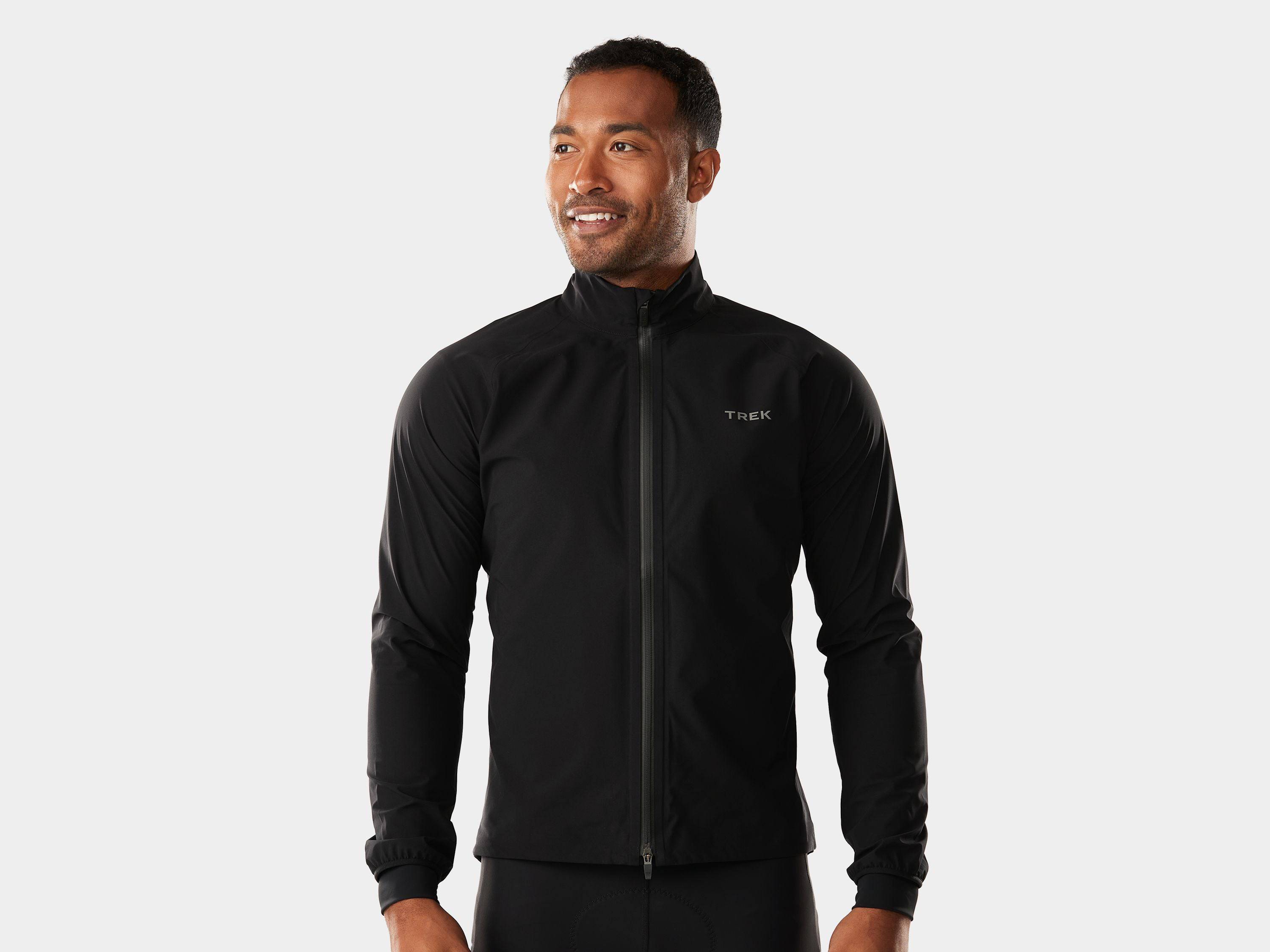 Trek Circuit Rain Cycling Jacket waterproof and breathable, shown folded and partially worn, ideal for all-weather bike rides.