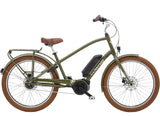 Electra Townie Go! 5i EQ step-over e-hybrid bike with Bosch Active Line Plus motor and Shimano Nexus gears, shown outdoors.