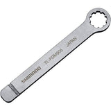 Shimano TL-FDM905 chain guide assembly tool for precise workshop use, shown in a workshop setting with tool components visible.