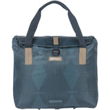 Basil Elegance Bicycle Shopper Bag in estate blue with hook-on system, showing the bag attached to a bicycle rack.