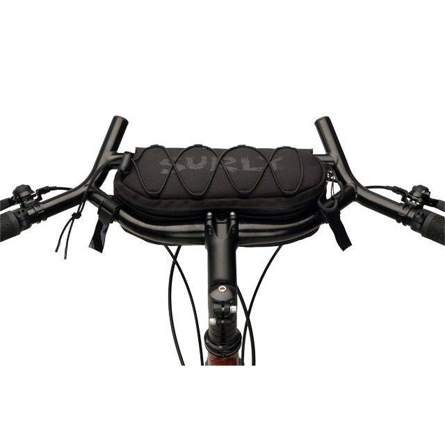 Surly Moloko handlebar bag for bikes, mounted on a bicycle handlebar, designed for cycling accessories and storage.