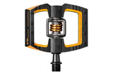 Crankbrothers Mallet DH 11 downhill pedals in black and gold with adjustable release angle and durable metal construction.