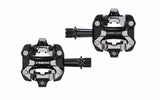 Trek Kovee Comp black clipless MTB and road bike pedal set with 9/16-inch spindle, durable cycling components.