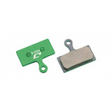 Jagwire Pro E-Bike disc brake pads for Shimano and RideRever cargo bikes, featuring green anti-squeal design and high-performance components.